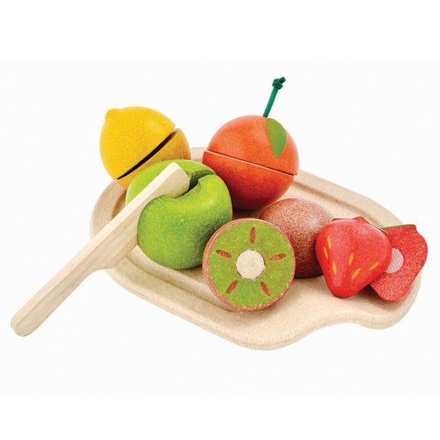 Cut Up Fruits Tray with wooden knife and colorful fruits including apple, lemon, orange, kiwi, and strawberry on a tray.