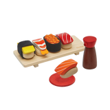 PlanToys Sushi Set with wooden sushi pieces, tray, shoyu bottle, and sauce dish for pretend play.