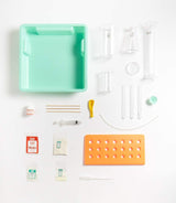 Kitchen Science Lab with clear lab vessels, measuring tools, powders, and storage sink for exciting experiments.