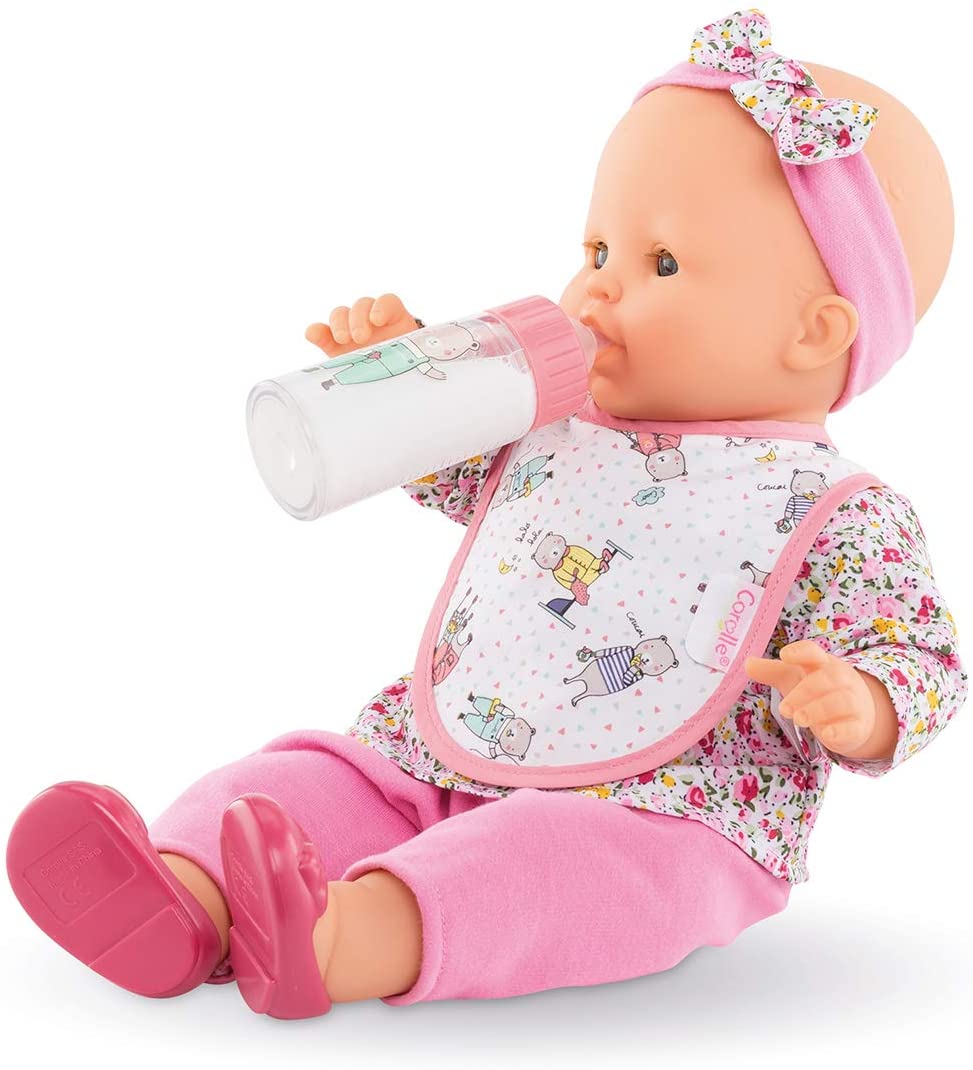 Magic Bottle & Bib showing doll wearing a floral bib and headband while holding a feeding bottle.