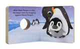 Baby Penguin with Finger Puppet board book open to cozy scene of baby penguin snuggling with mama penguin.