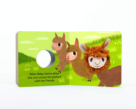 Open board book "Baby Llama with Finger Puppet" showing illustrated llamas and a plush finger puppet.