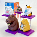 Tea Time Animal Blind Box featuring cute animal figurines sipping tea on purple cushions in a friendly, calming scene.
