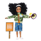 Lottie Kid Activist doll with curly hair, green bomber jacket, denim shorts, megaphone, and Kids Voices Matter sign.