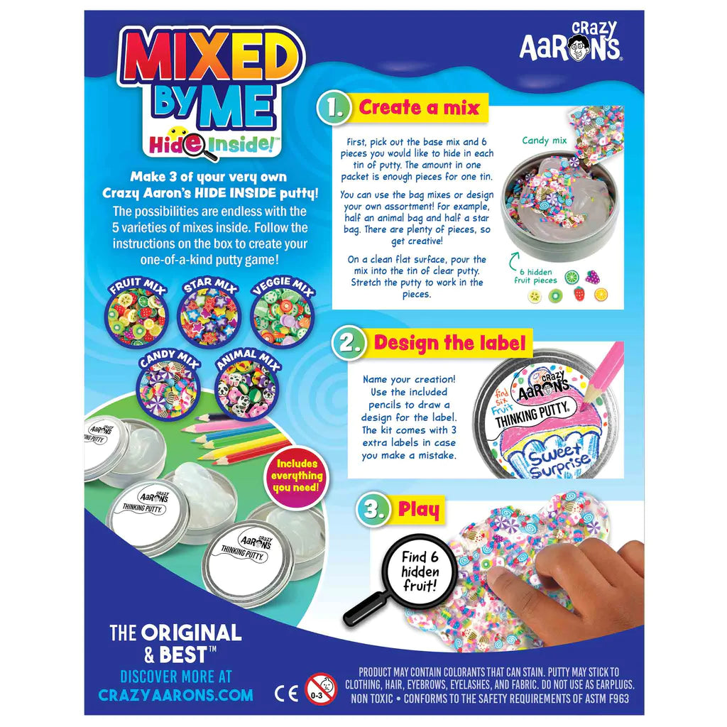 Mixed by Me Hide Inside Thinking Putty kit with mixes, tins, labels, and colored pencils for custom putty creations.