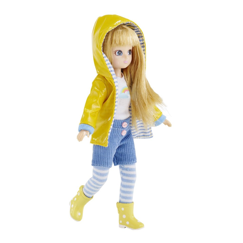 Lottie Muddy Puddles Doll wearing yellow raincoat, striped leggings, corduroy shorts, and rain boots.