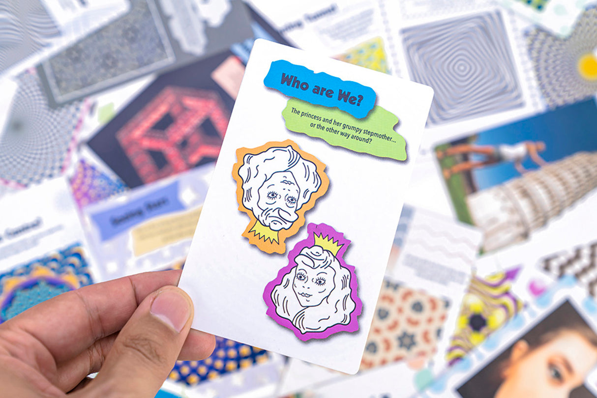 Hand holding an Optical Illusions card with puzzling faces and colorful speech bubbles from the Optical Illusions set.