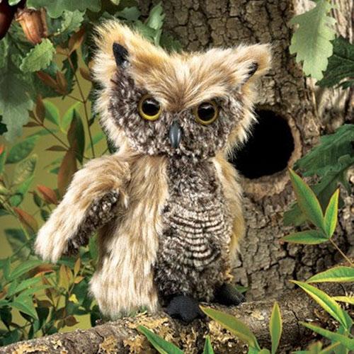 Screech Owl Puppet with soft tan and grey plush feathers perched on a tree branch near a hollow.