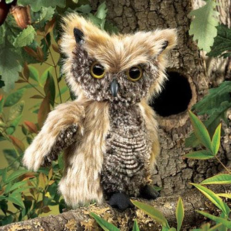 Screech Owl Puppet with soft tan and grey plush feathers perched on a tree branch near a hollow.