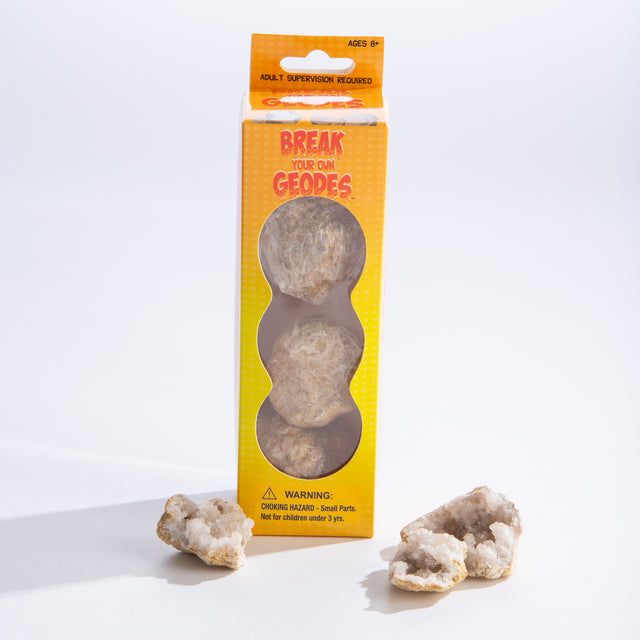 Moroccan Geodes box with three natural quartz geodes and two cracked open showing white crystal interiors.