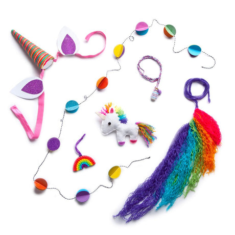 i <3 unicorns kit showing colorful unicorn headband, garland, rainbow charm, unicorn stuffie, and rainbow yarn tail craft pieces.