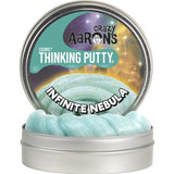 Cosmic Glows Infinite Nebula Thinking Putty in open tin showing shimmering aqua putty with space-themed label design.
