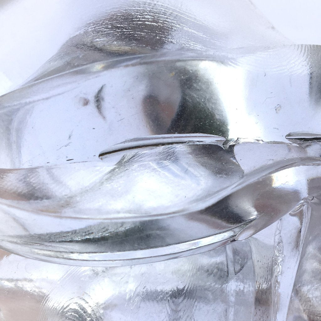 Close-up of Liquid Glass Crystal Clear Thinking Putty showing its transparent, glossy, and flowing texture.