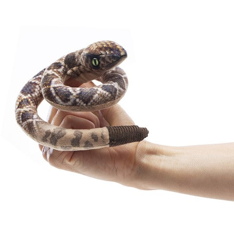 Rattlesnake Finger Puppet coiled on finger with printed snakeskin and rattle, designed for ages 3 and up.